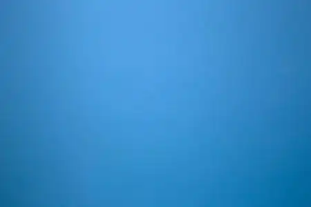 纯色石墙上的蓝色作为背景纹理.美丽的现代复古色彩照片