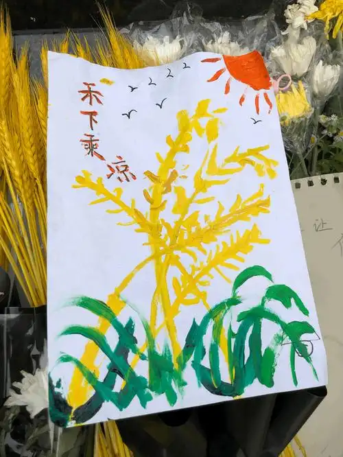 袁隆平逝世一周年,雕像前小朋友手绘"禾下乘凉"|袁隆平_新浪财经_新浪