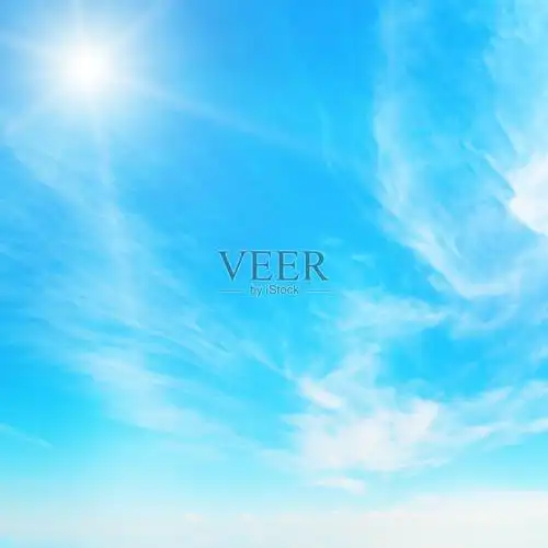 蓝天白云上的太阳照片摄影图片