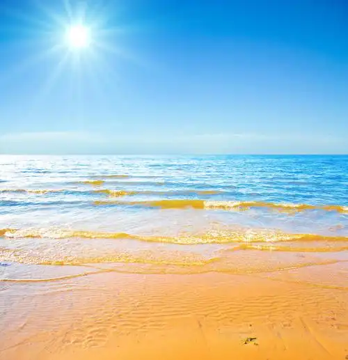 太阳阳光光线光芒风景大海蓝色蓝天海洋海浪海滩海岸线黄色沙滩浪花