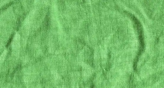 绿色亚麻布的质地.绿色亚麻背景照片