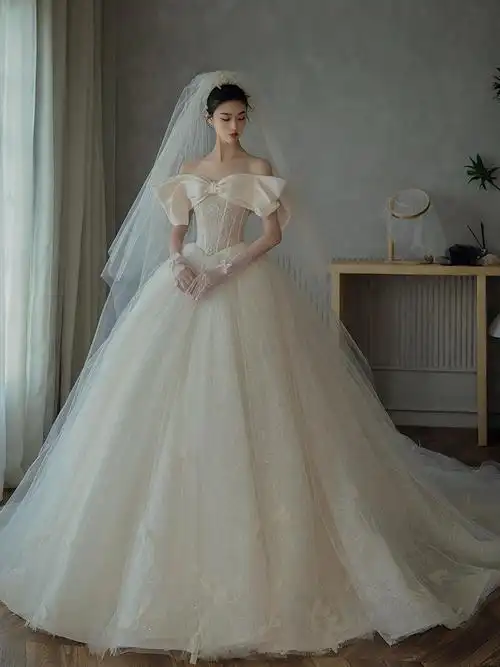 一字肩缎面婚纱2022新款春夏季新娘主纱抹胸蝴蝶结宫廷风长拖尾女