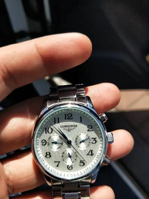 谁能帮我看看这浪琴表多少钱,真的假的?