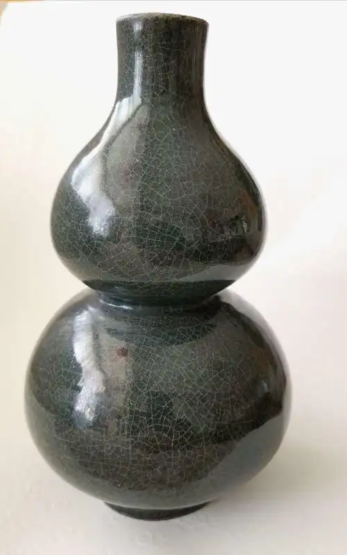 再谈南宋龙泉溪口窑墨绿釉黑胎瓷器.