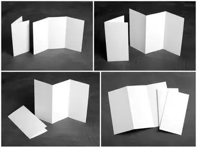 空白的白色黑色的黑板上折叠纸传单照片