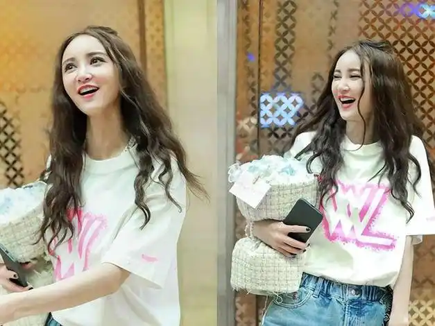 张歆艺新发型堪比"整容",烫微卷长发上班撞脸姚笛,形象大变样|露脐装