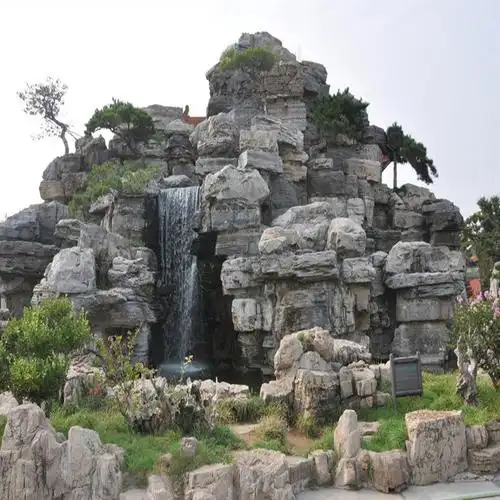 中式古典太湖石假山搭配流水绿化鱼池建造过滤池喷漆雾化风景太湖石