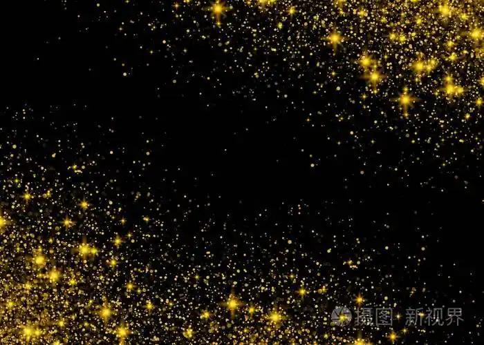 闪闪发光背景发光黄金星尘埃火花在黑色背景上爆炸.闪光的粒子效果.