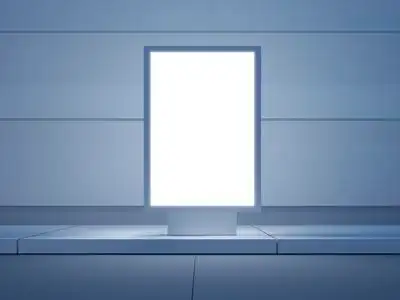 在空荡荡的街道上的白色灯箱.在背景中的现代建筑.前视图.3d 渲染照片