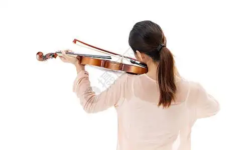 拉小提请的青年女性背影图片素材