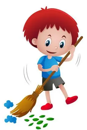 红发男孩拿着扫把扫地上的绿叶