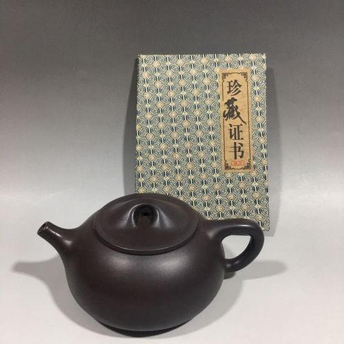品名:石瓢紫砂壶底款:葛陶中17/7cm400cc紫砂分类:紫茄泥
