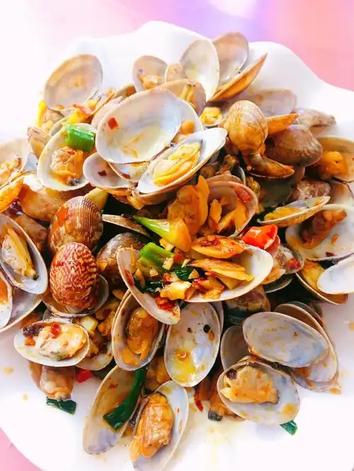 炒葱油花甲怎么做才好吃 葱油花甲的做法简单易学窍门