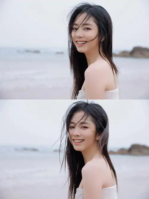 谭松韵穿白色礼服海边拍写真秀事业线肌肤雪白笑容灿烂超可爱