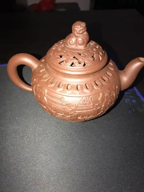 盛记镂空雕刻紫砂狮子头壶请大师帮鉴定下真假