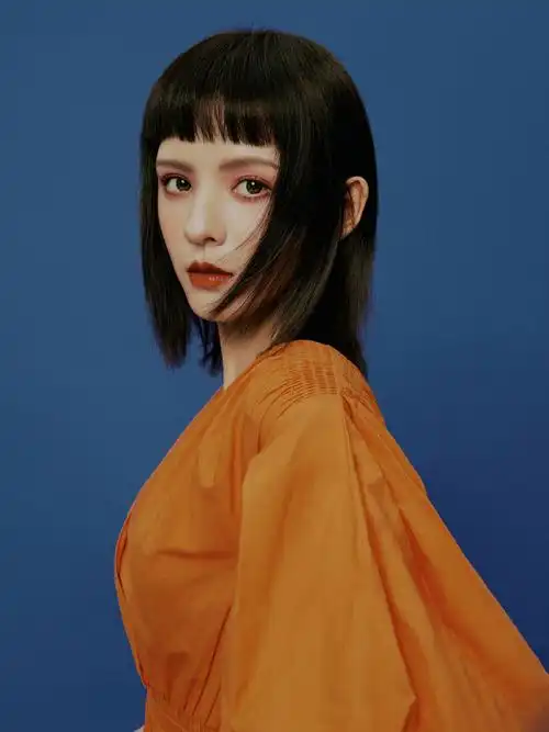 张予曦橘色元气妆酷美写真图片