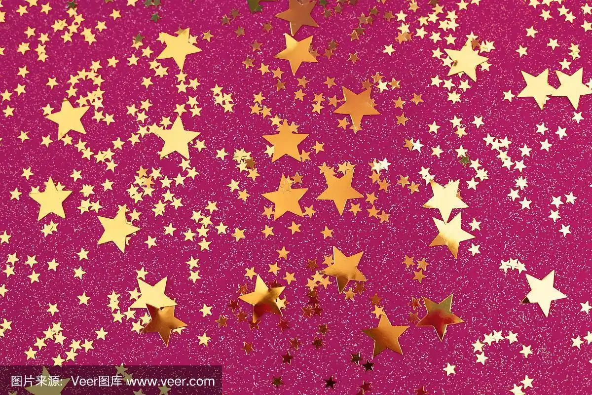 金色的星星,粉红色的背景.
