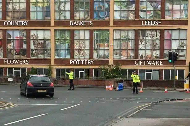 police directing traffic via common lane, east ardsley