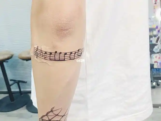 爱意东升西落浪漫至死不渝音符纹身