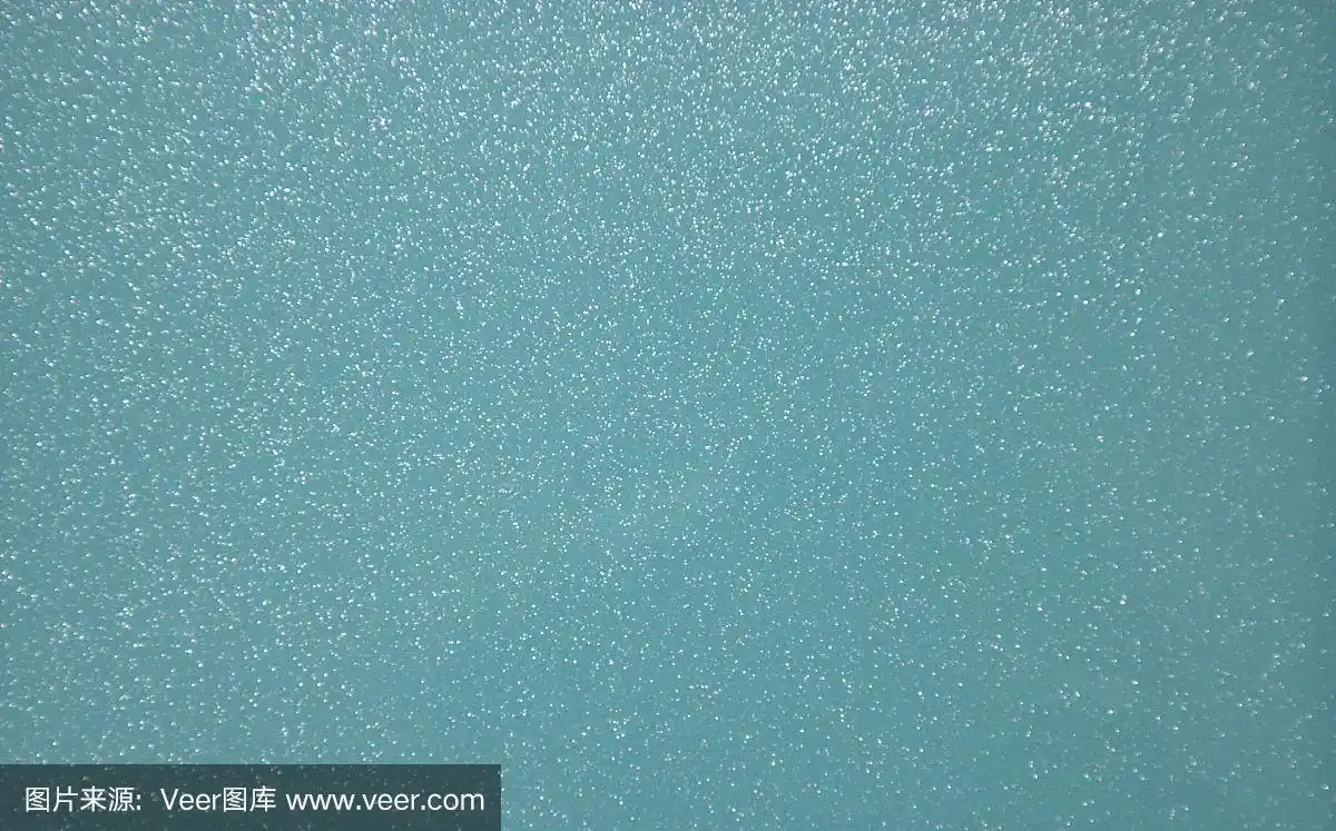 蓝色珠光透明背景与金属飞溅.背景.纹理.特写镜头.