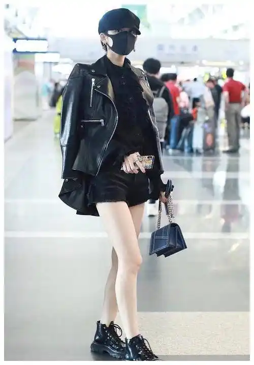 古力娜扎戛纳回程皮衣搭配马丁靴一身酷帅造型尽显长腿