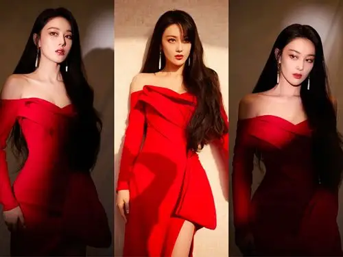 张馨予轻抚发丝,一袭红色露肩连衣裙像是为其量身定做的一般,将s形