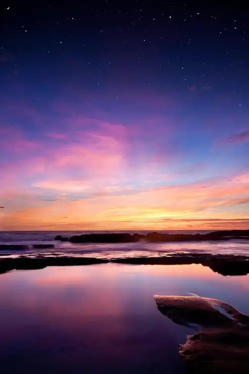 夕阳与满天星斗的天空高清壁纸海边