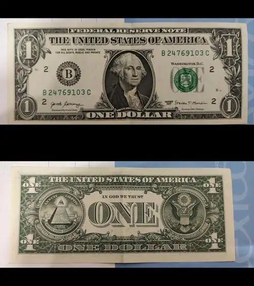 一美元背面印着的金字塔和眼睛的图案,是美国国徽的一个元素,它包含了