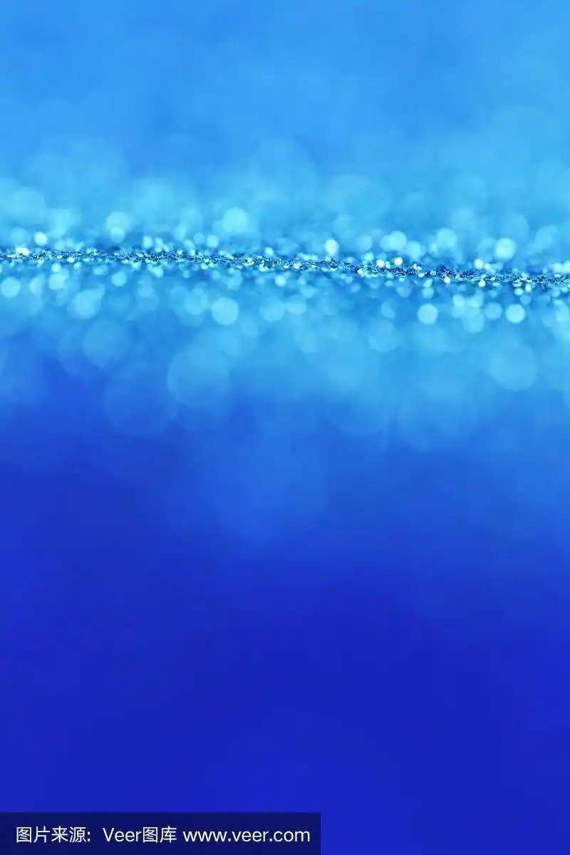 蓝色闪光背景与浅蓝色闪光散景.潘顿经典的蓝色.