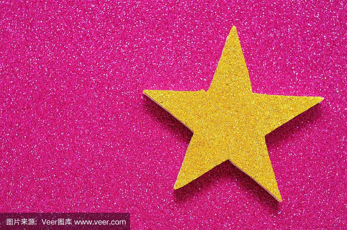 一颗金色的星星在闪亮的粉红色背景上