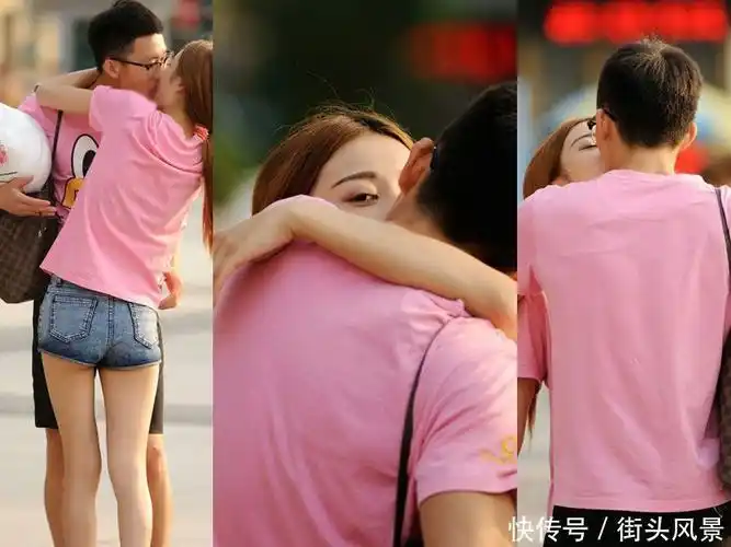 身穿情侣装的一对情侣大街上大胆秀恩爱视旁人为空气