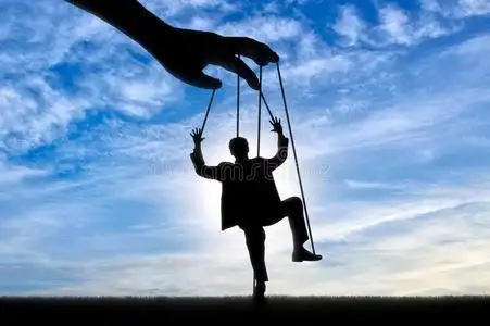 男人牵线木偶.男人ipulation观念照片