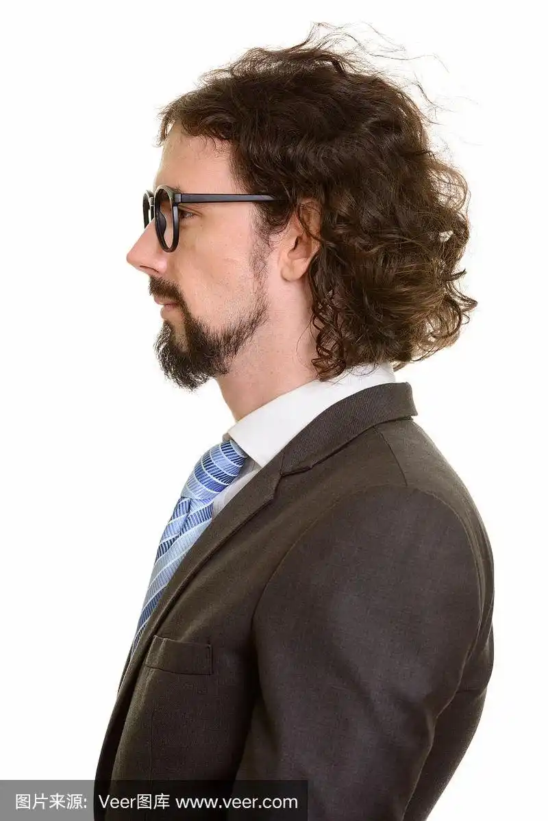 戴着眼镜的英俊商人的脸的侧面视图