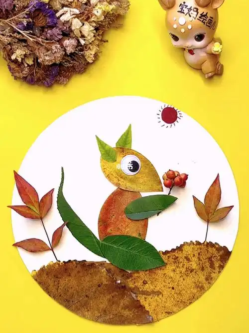 树叶手工画小松鼠吃果子树叶贴画