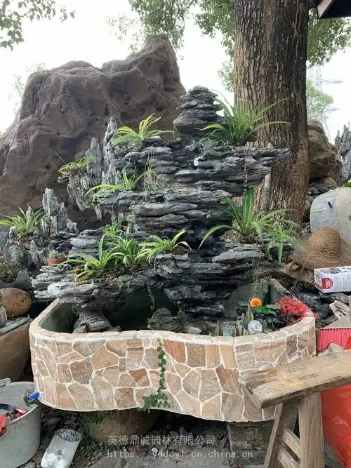 黑片石英石真石假山制作好的鱼池庭院山水打包发货