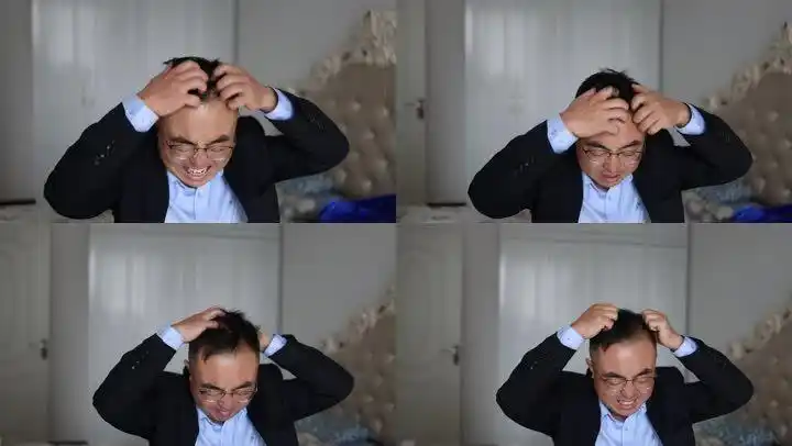 抓狂精神崩溃抓头发的中年白领