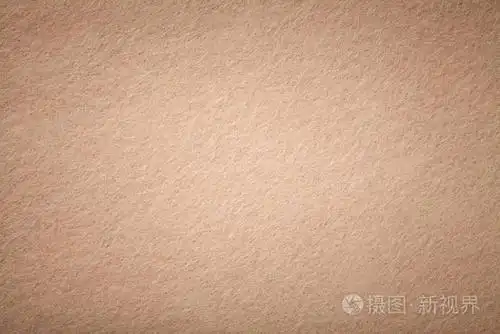 浅棕色哑光背景的绒面织物特写天鹅绒质地无缝米黄色羊毛毡与维内特