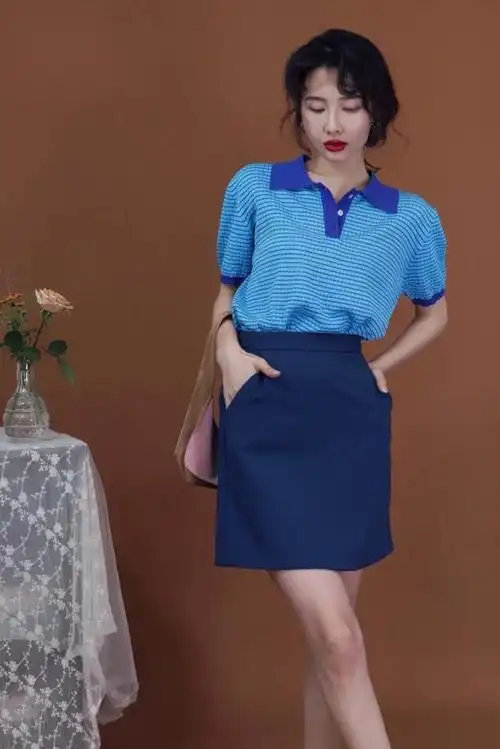 所创造的时尚单品也会更具经典韵味,选择高腰半身裙作为搭配