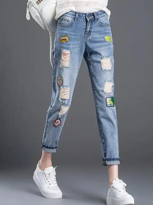 娅诺妮 个性布贴破洞牛仔九分裤