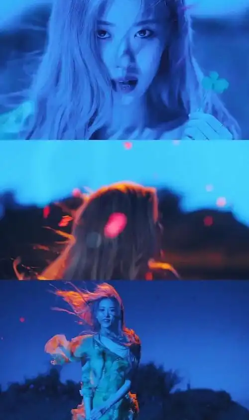 淡黄的长裙,蓬松的头发,蓝色月光下的rose犹如带刺的玫瑰,冷艳又性感.