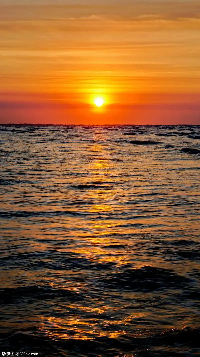 海滩上的日落之时背景图海平面